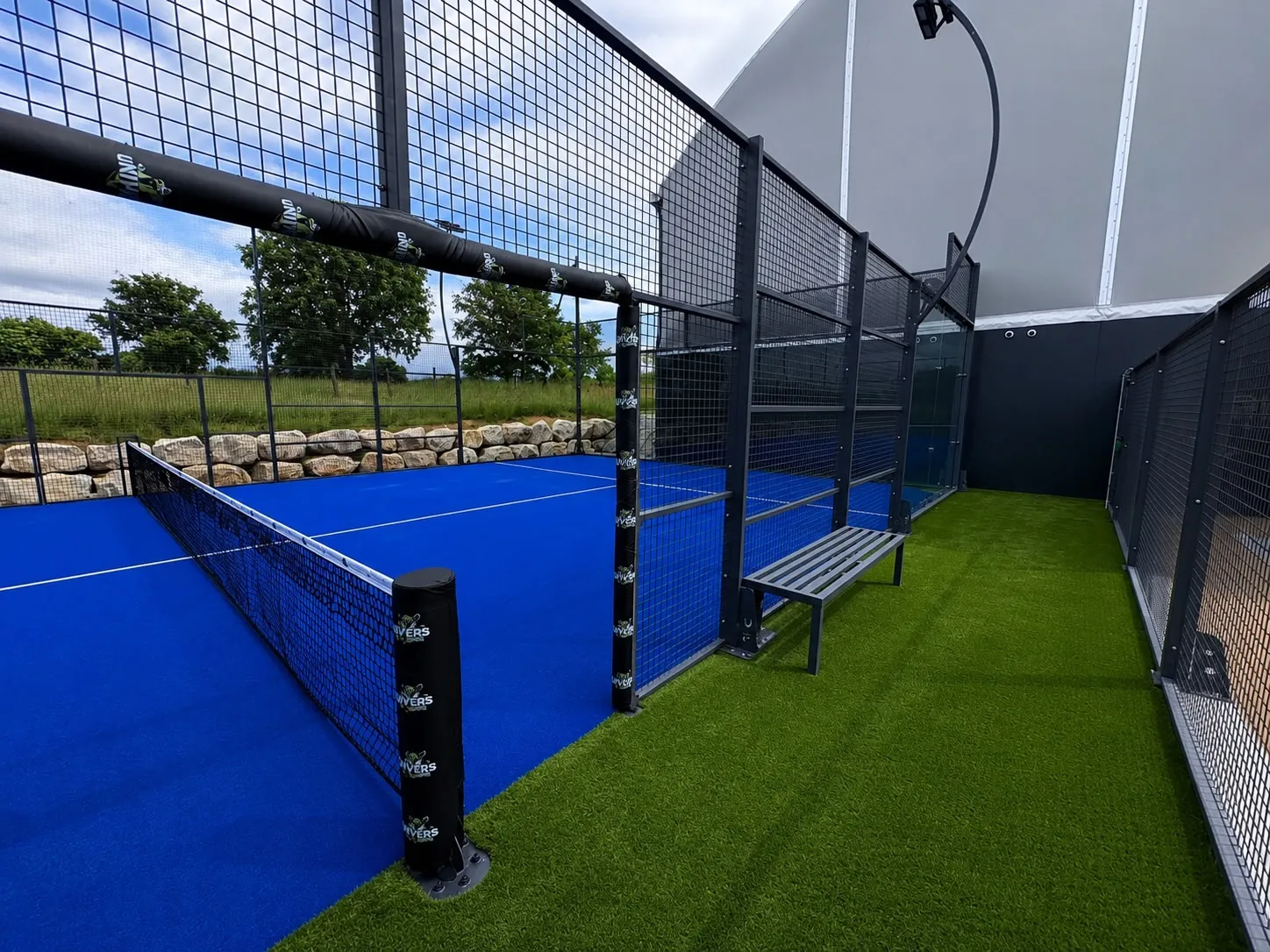Completed blue padel court installation at a club in France